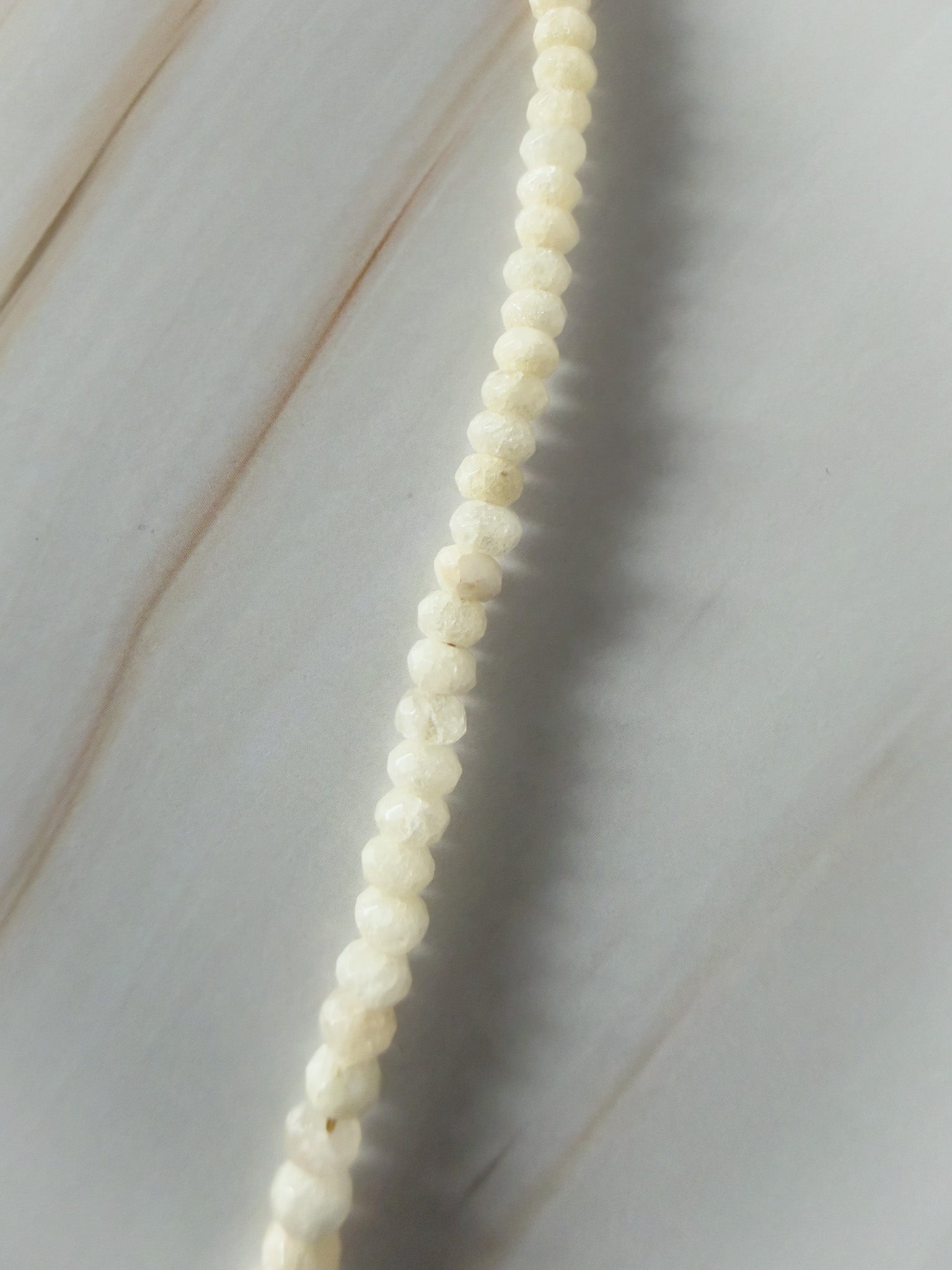 String of small white jade beaded necklace